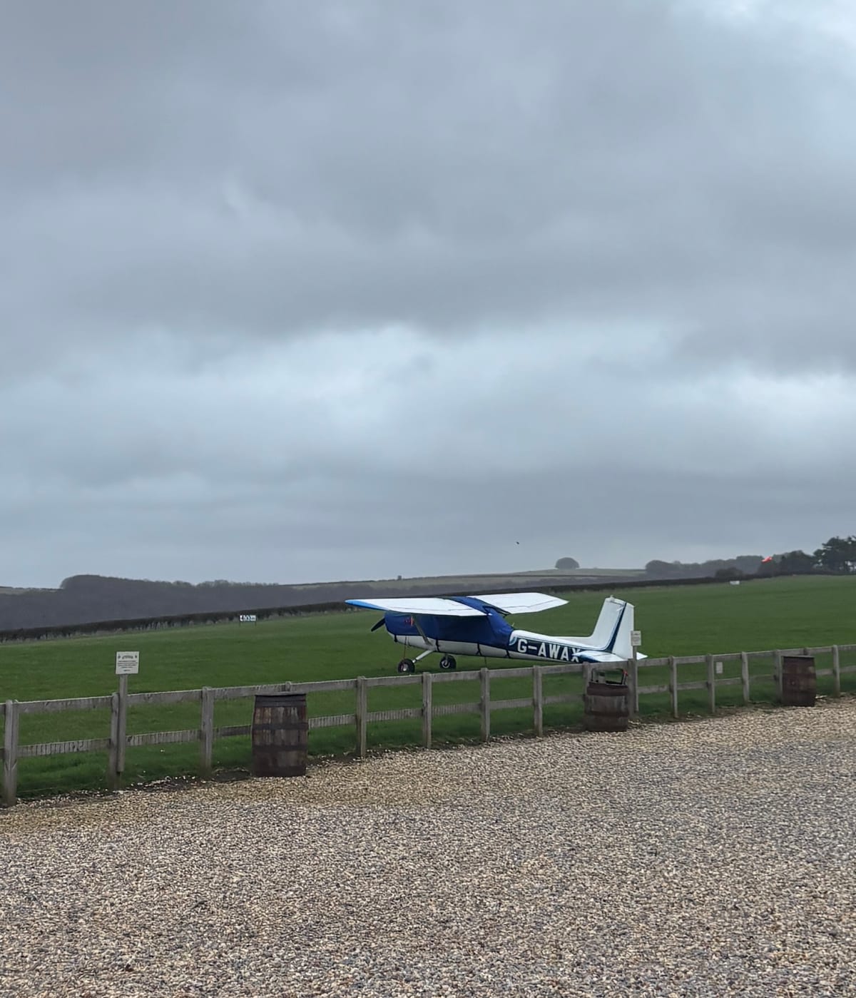 A plane at Compton Abbas Airfield on an overcast day