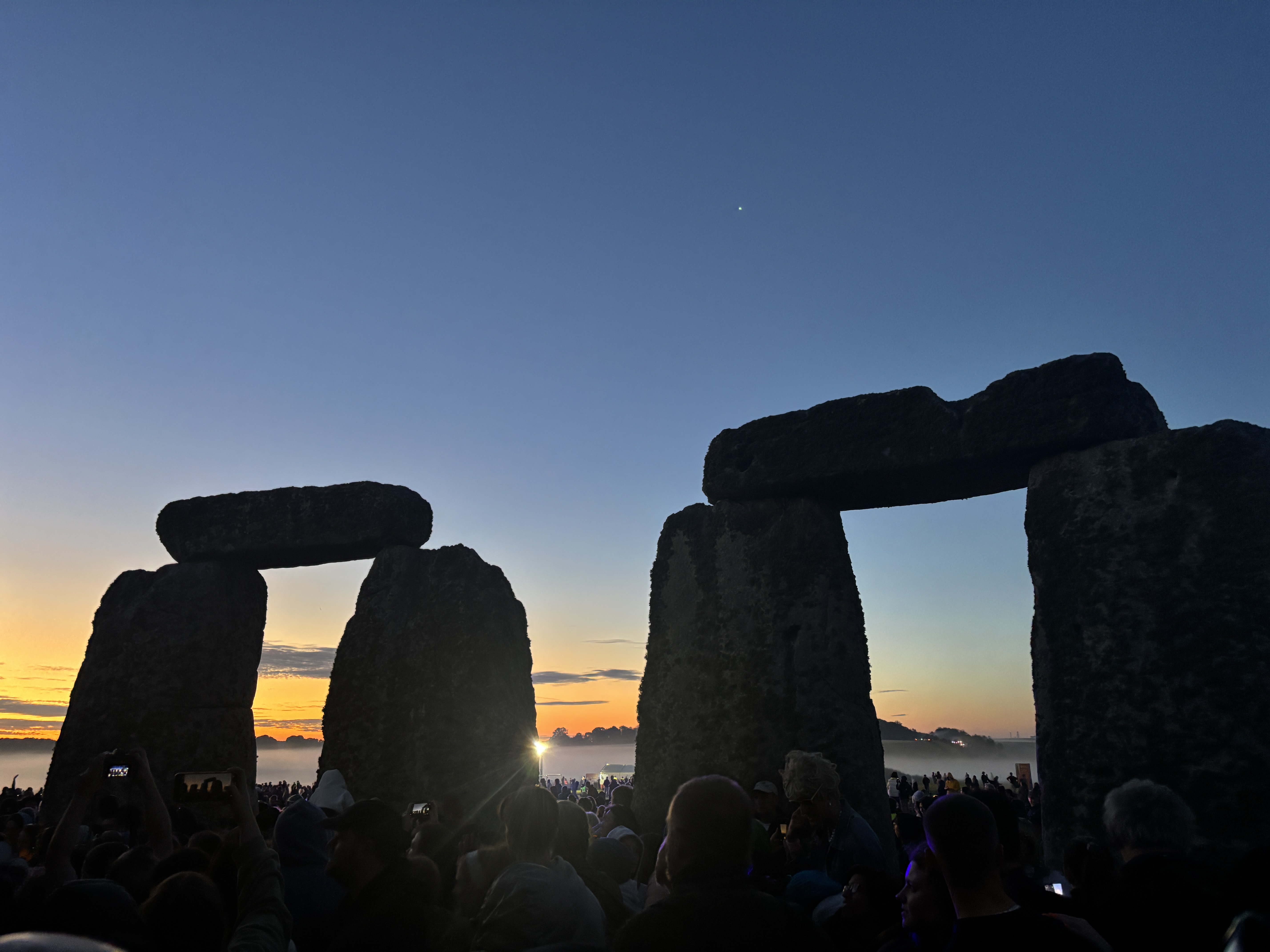 Inside of Stonehenge at the Summer Solstice, showing the stones up close.